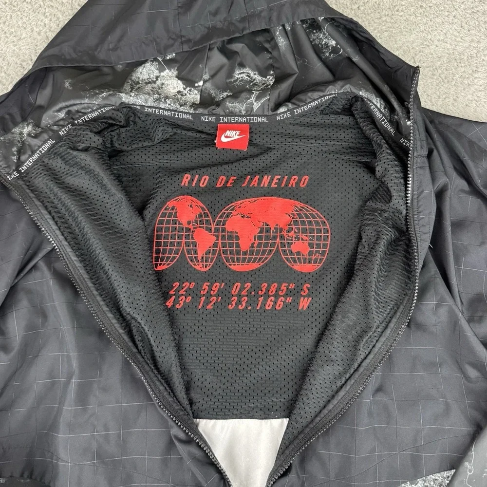 Nike International Jacket Womens Large‎ Black Print Hooded Windbreaker Running